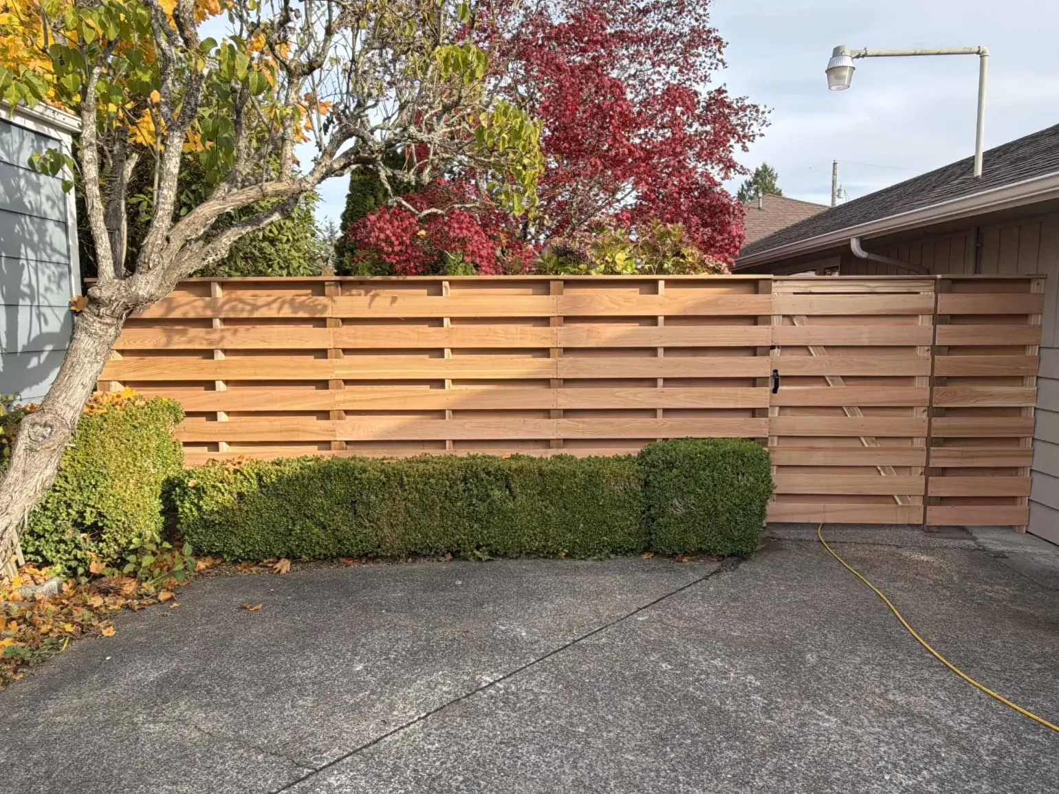Cedar board-on-board solid privacy fence cost — Overland Park, KS — RKC Wood Care Pros