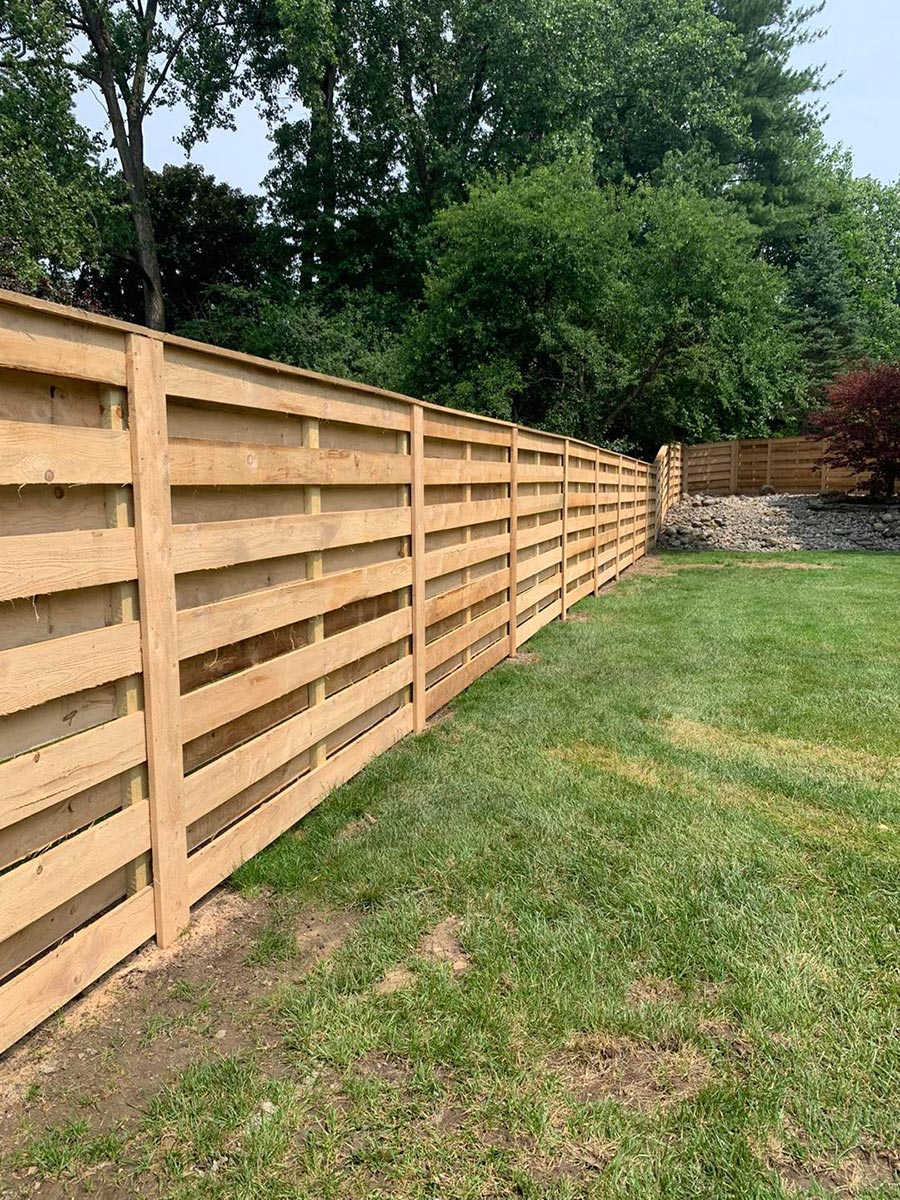 Tongue-and-groove vinyl privacy fence panel in Overland Park, KS — RKC Wood Care Pros