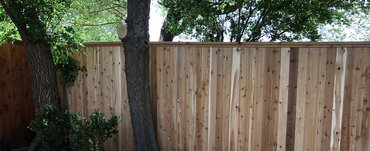 Good-neighbor equal-finish privacy fence install in Peculiar, MO — RKC Wood Care Pros