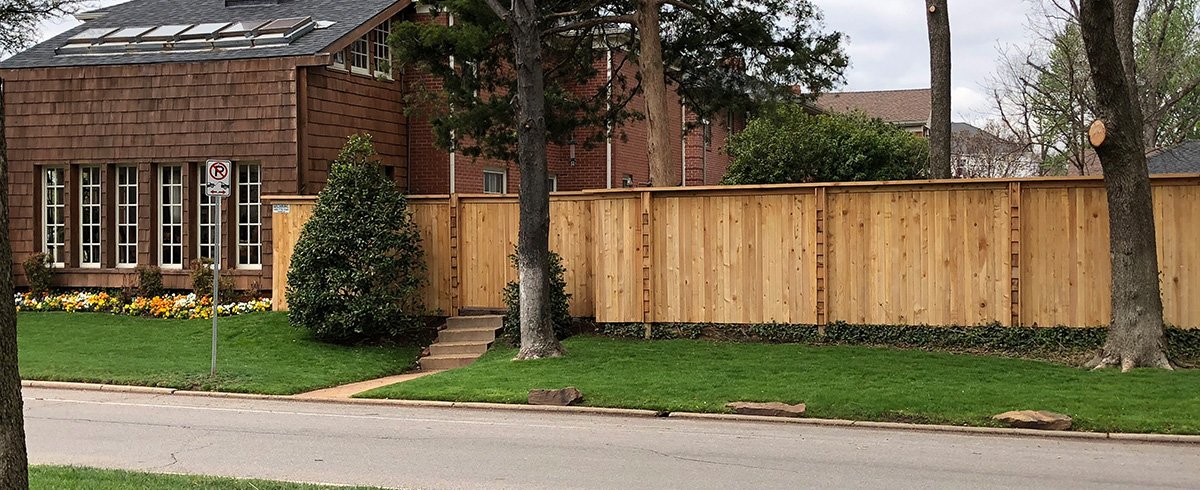 Tongue-and-groove vinyl privacy fence panel in Peculiar, MO — RKC Wood Care Pros
