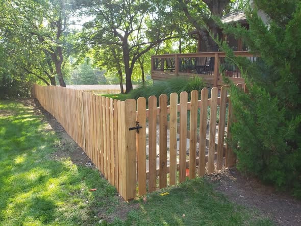 Cedar board-on-board privacy fence with kickboard in Grandview, MO — RKC Wood Care Pros