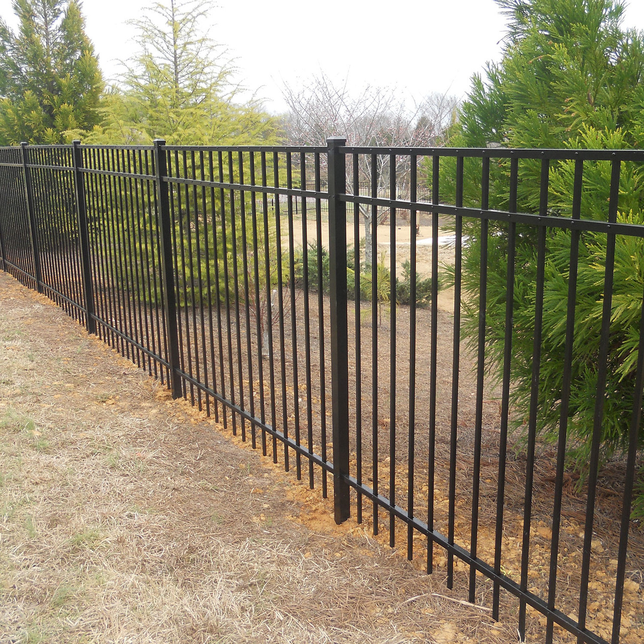 Dumpster screening enclosure with property line demarcation in Grandview, MO — RKC Wood Care Pros