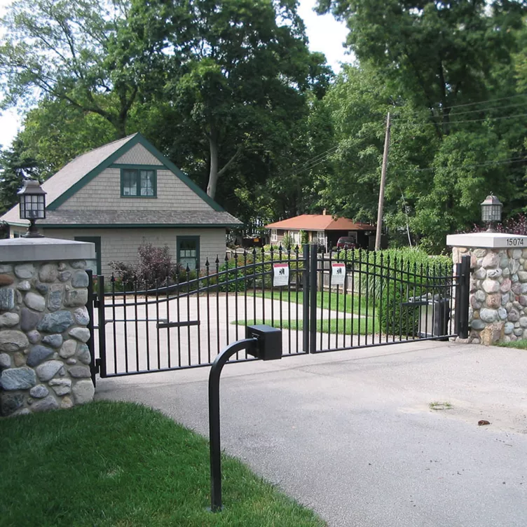 Ornamental iron spear-top double drive gate cost — Smithville, MO — RKC Wood Care Pros