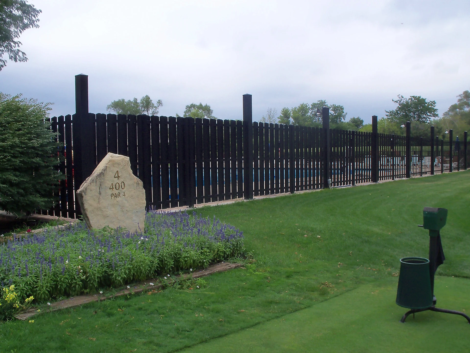 Commercial 6-gauge chain link perimeter with truss-rod bracing in Leawood, KS — RKC Wood Care Pros