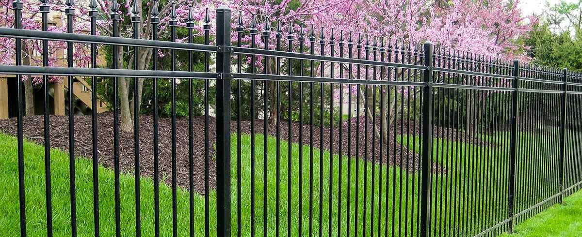 Welded steel commercial security fence with crash-rated posts in Lenexa, KS — RKC Wood Care Pros