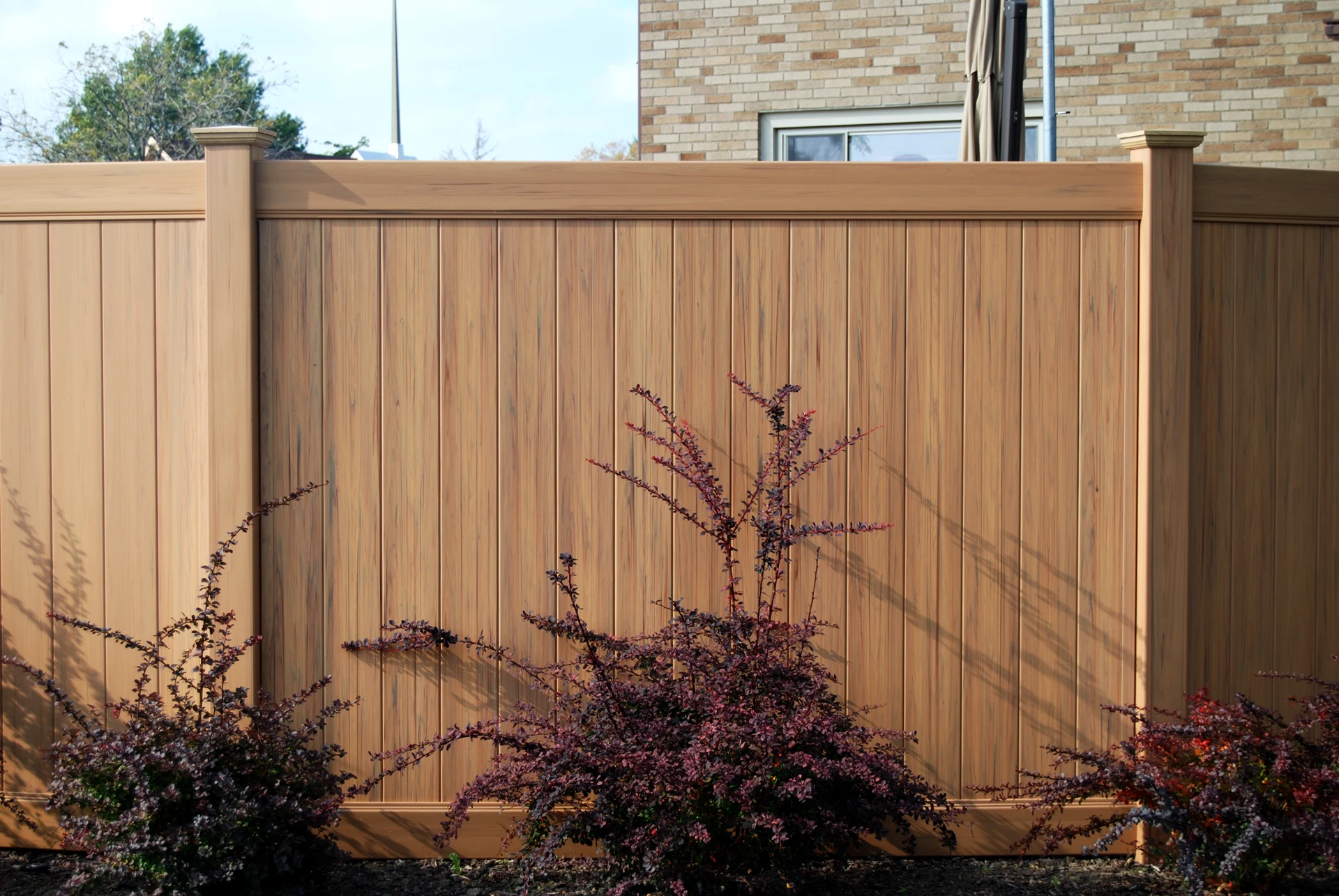 Tongue-and-groove vinyl privacy fence panel in Spring Hill, KS — RKC Wood Care Pros