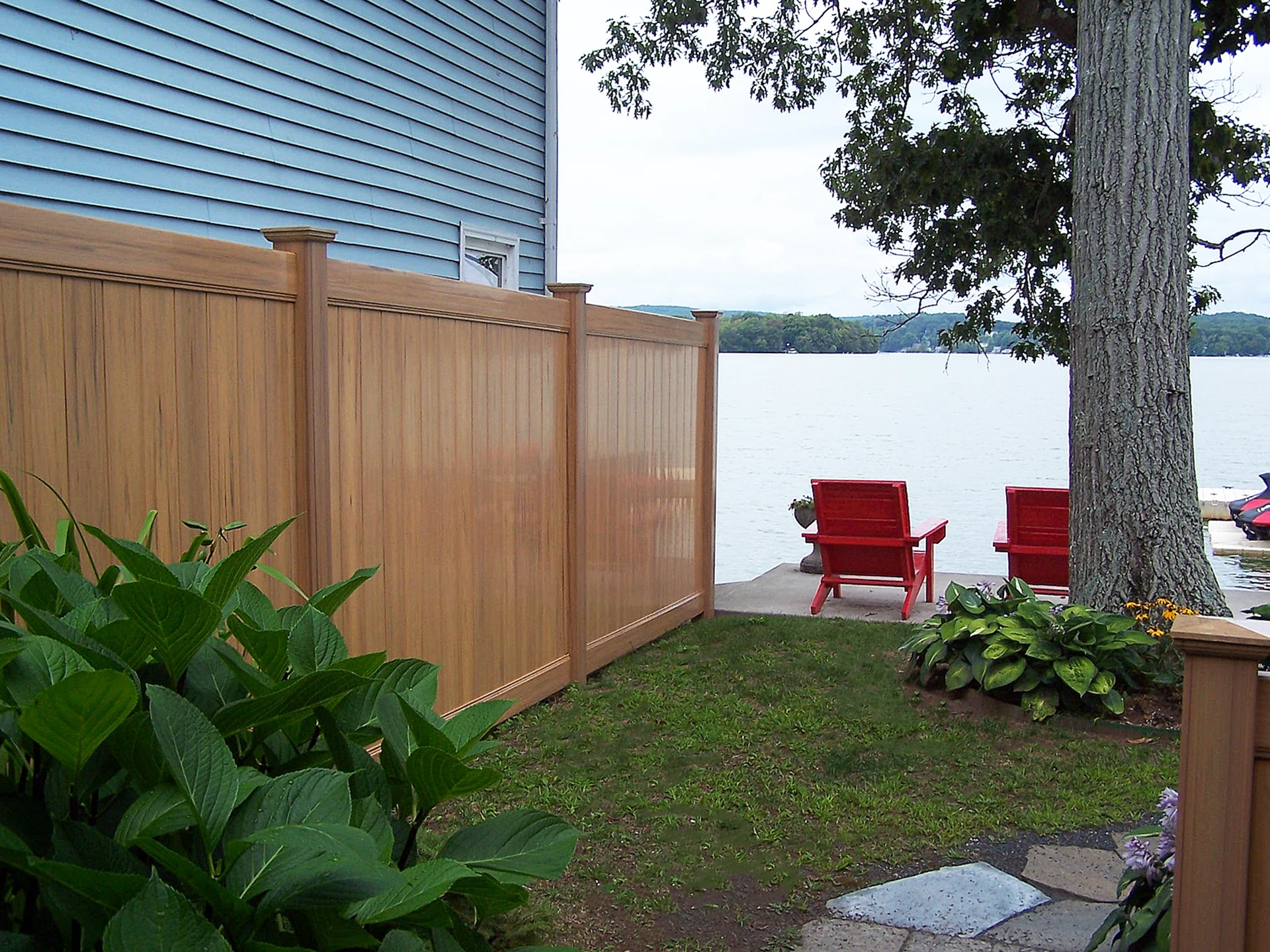 Good-neighbor equal-finish privacy fence install in Spring Hill, KS — RKC Wood Care Pros