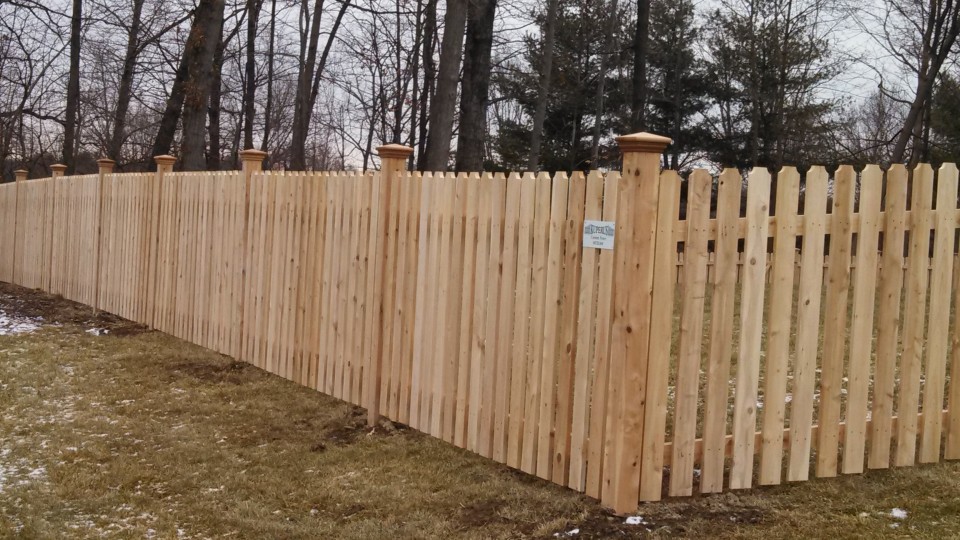 Cedar board-on-board privacy fence with kickboard in Pleasant Hill, MO — RKC Wood Care Pros