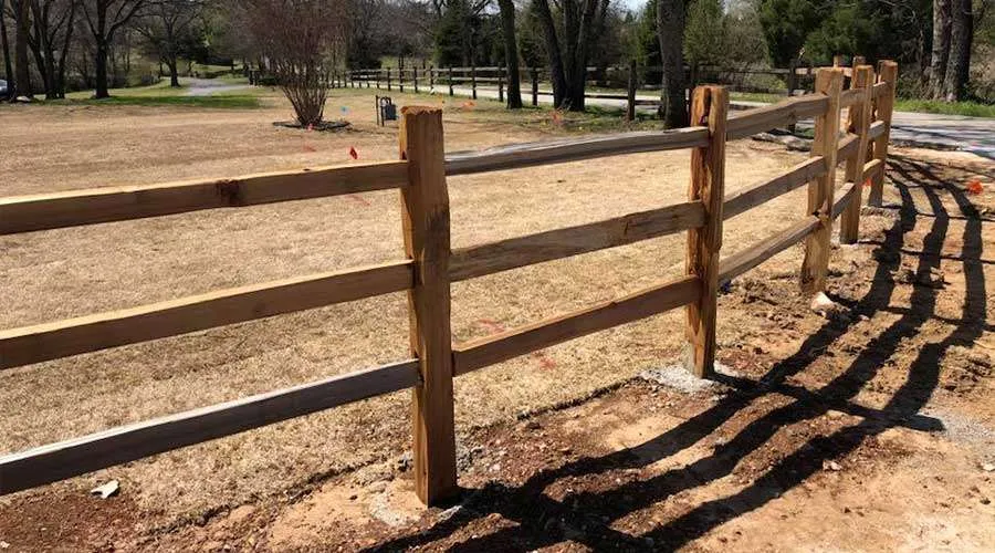 Cedar dog-ear picket privacy fence with galvanized ring-shank fastening in Prairie Village, KS — RKC Wood Care Pros