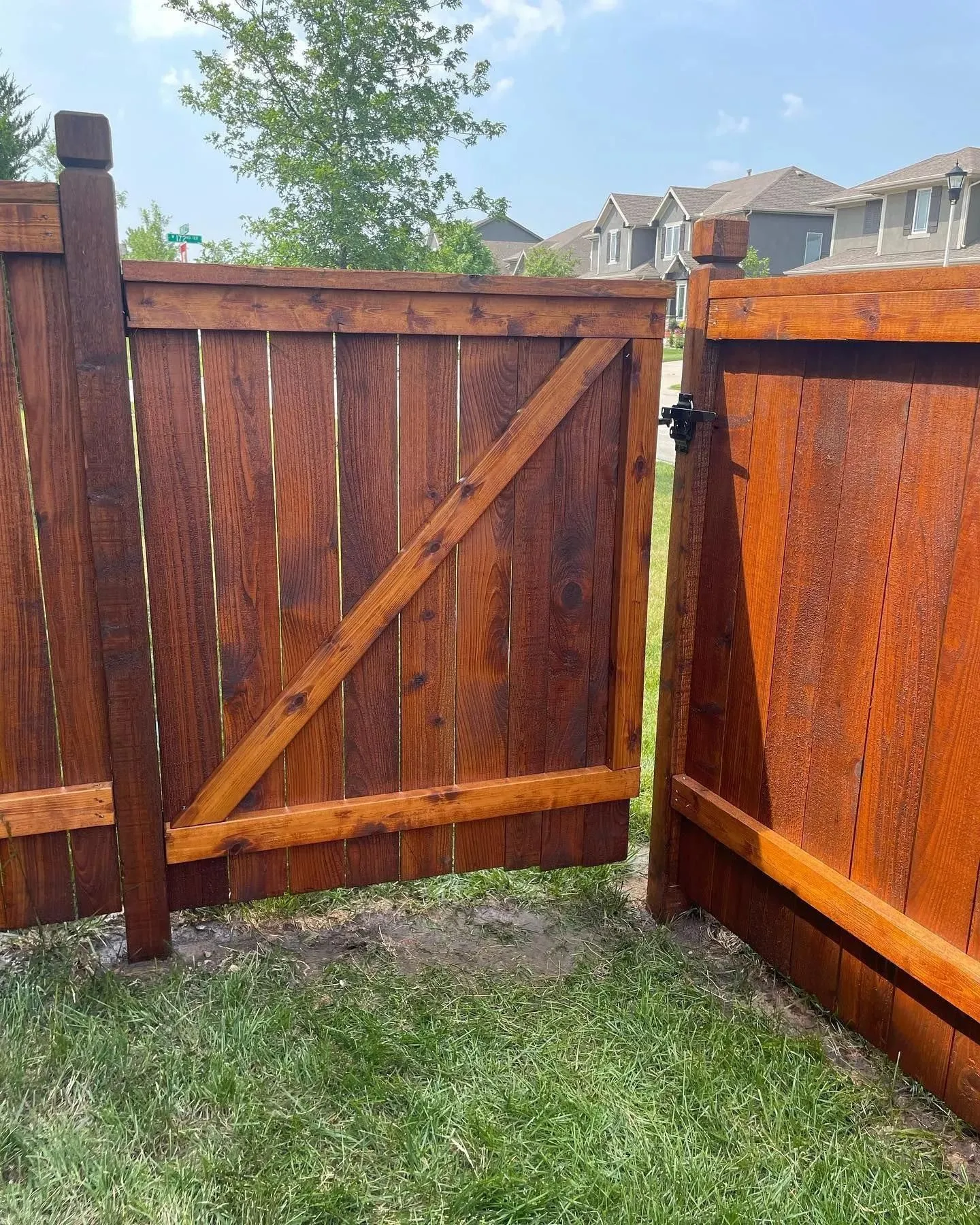 Board-on-board privacy fence in Shawnee KS by RKC Wood Care Pros