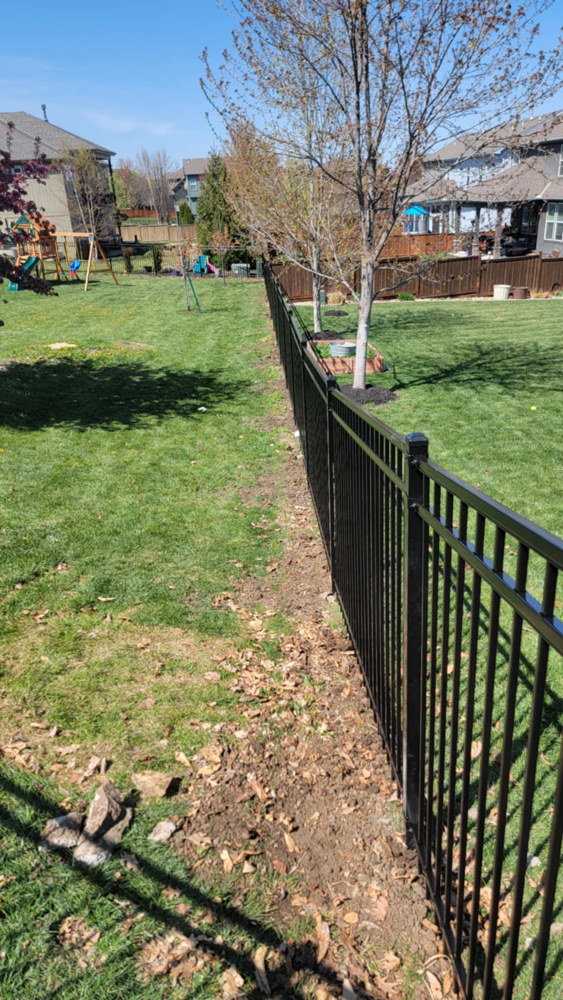 Aluminum fence installation in Lenexa, KS by RKC Wood Care Pros