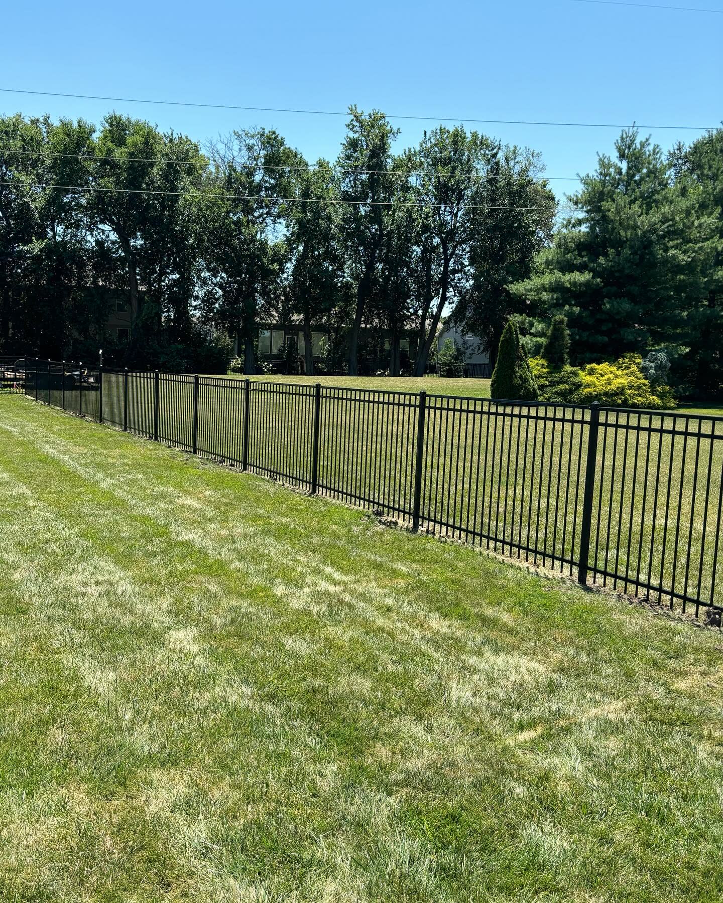 Aluminum fence installation in Mission, KS by RKC Wood Care Pros