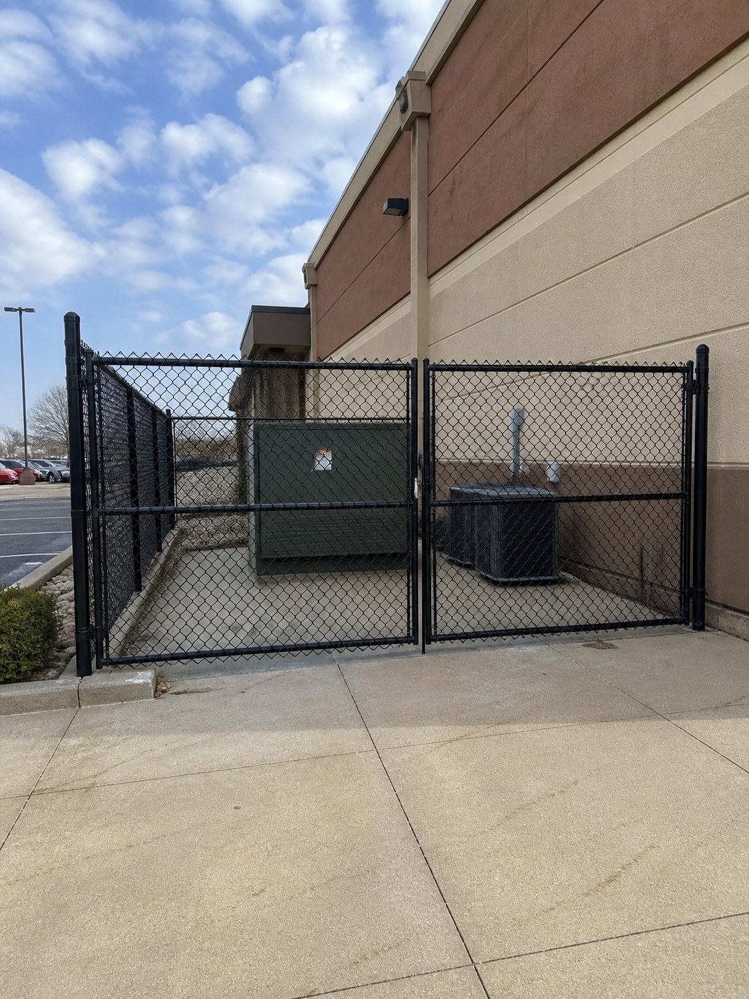 Galvanized chain link perimeter fence with knuckle-twist selvage in Grandview, MO — RKC Wood Care Pros