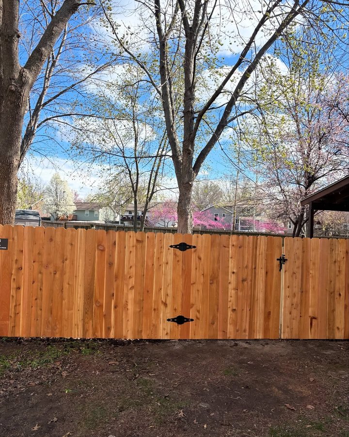 Finished cedar privacy fence install in a Grandview, Missouri backyard by RKC Wood Care Pros