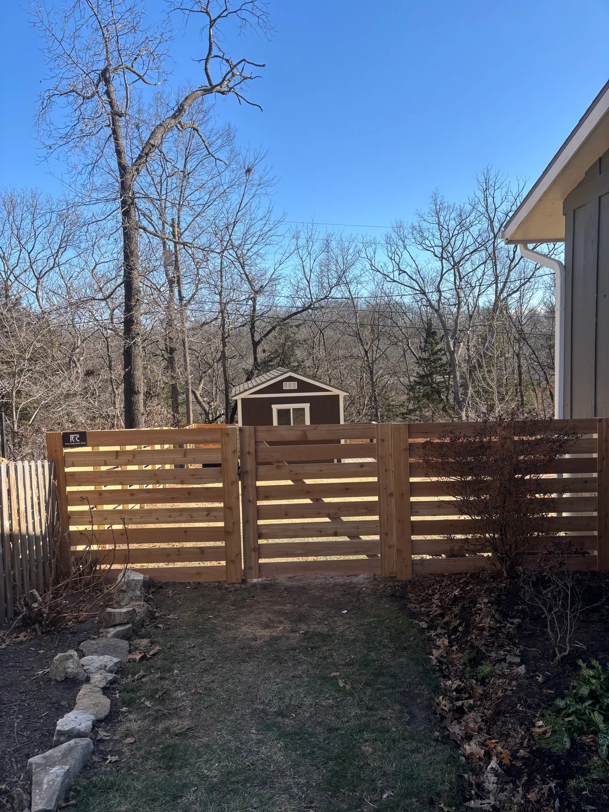 Far perspective of horizontal cedar fence running along Prairie Village, KS property line